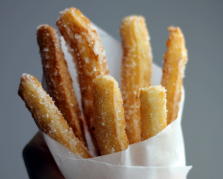 Professional churros station with gourmet dipping sauces at Singapore event